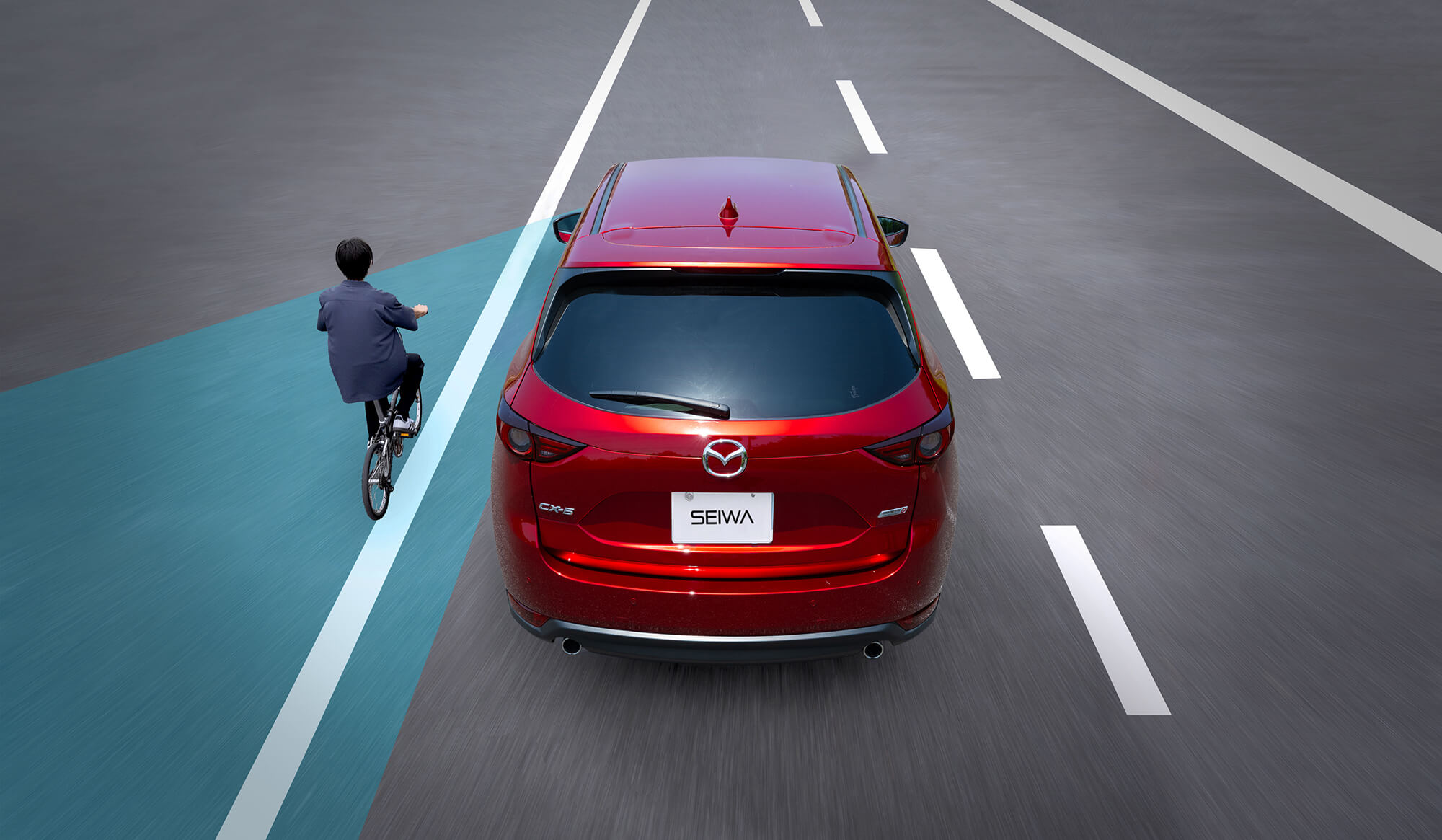 CX-5と自転車が並走している写真